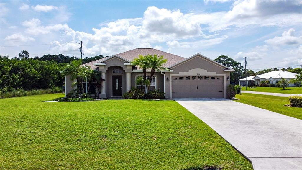 Photo of 1991 SW Fanfare Street St, Port St Lucie, FL 34987 (MLS # R10733966)