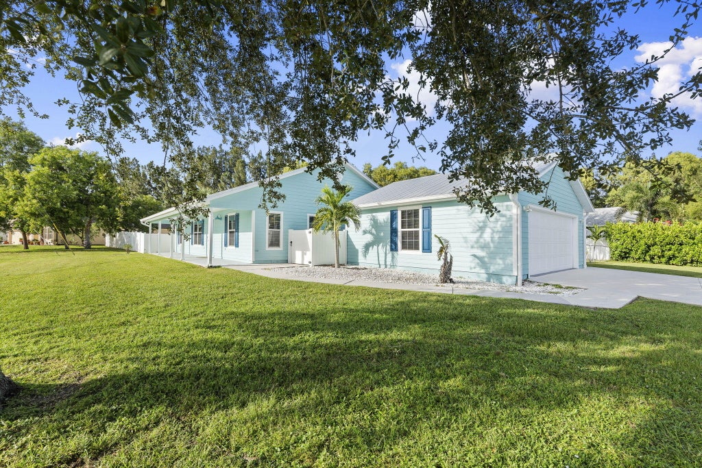 Photo of 6649 NW Omega Road, Port Saint Lucie, FL 34983 (MLS # R11135734)