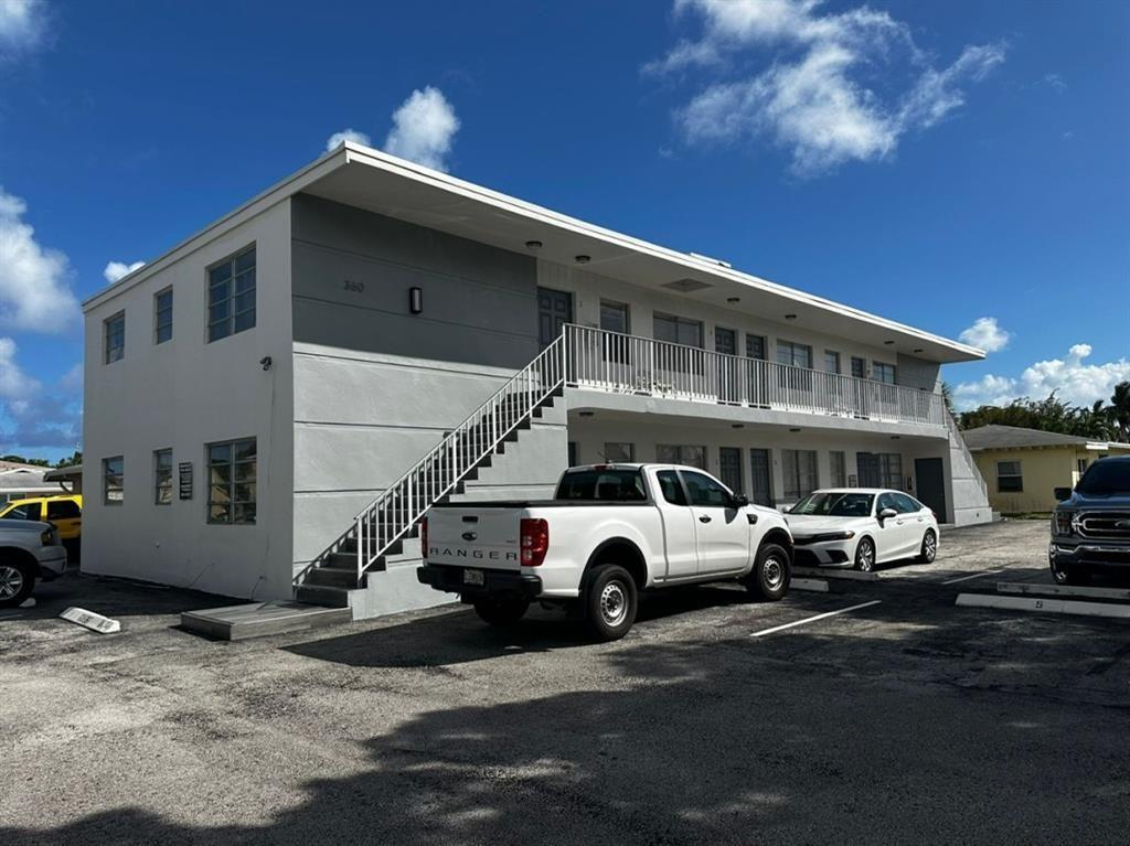Prime location just a few blocks from the Intercoastal, beach, restaurants - The perfect 1/1 in Deerfield Beach - This renovated one-bedroom apartment offers an unbeatable combination of style, comfort, and convenience, with the additional safety and energy efficiency afforded by impact windows and doors! Step into a spacious, open-concept living area with sleek modern finishes, including luxury vinyl flooring and fresh, coastal-inspired paint that radiates a light.