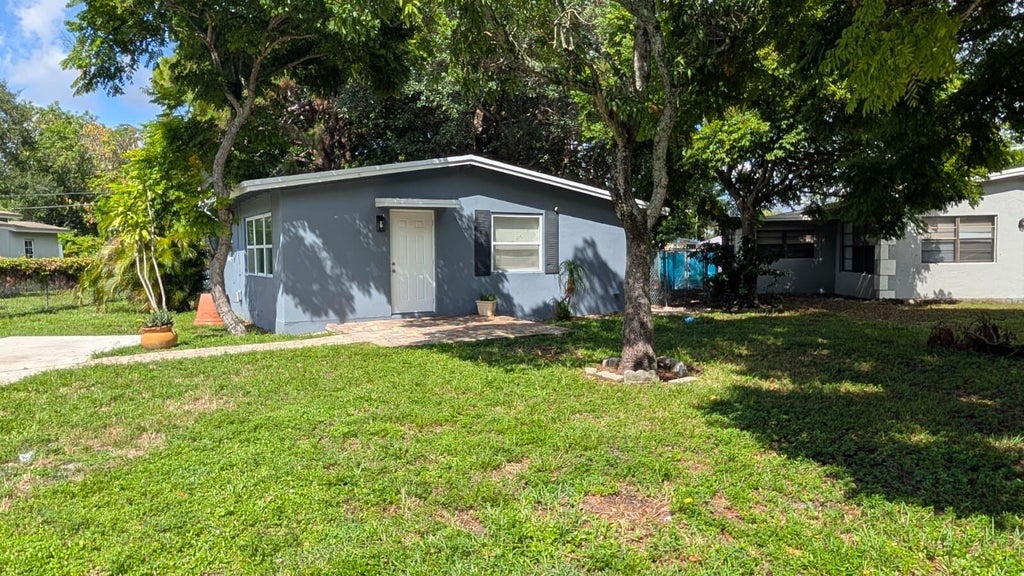 Photo of 1553 NW 15TH Terrace, Fort Lauderdale, FL 33311 (MLS # B26078745)