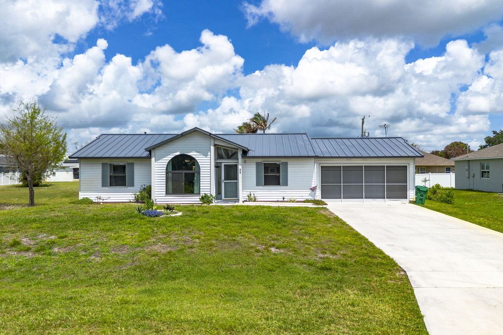 Photo of 409 SW Voltair Terrace, Port Saint Lucie, FL 34984 (MLS # B26018356)