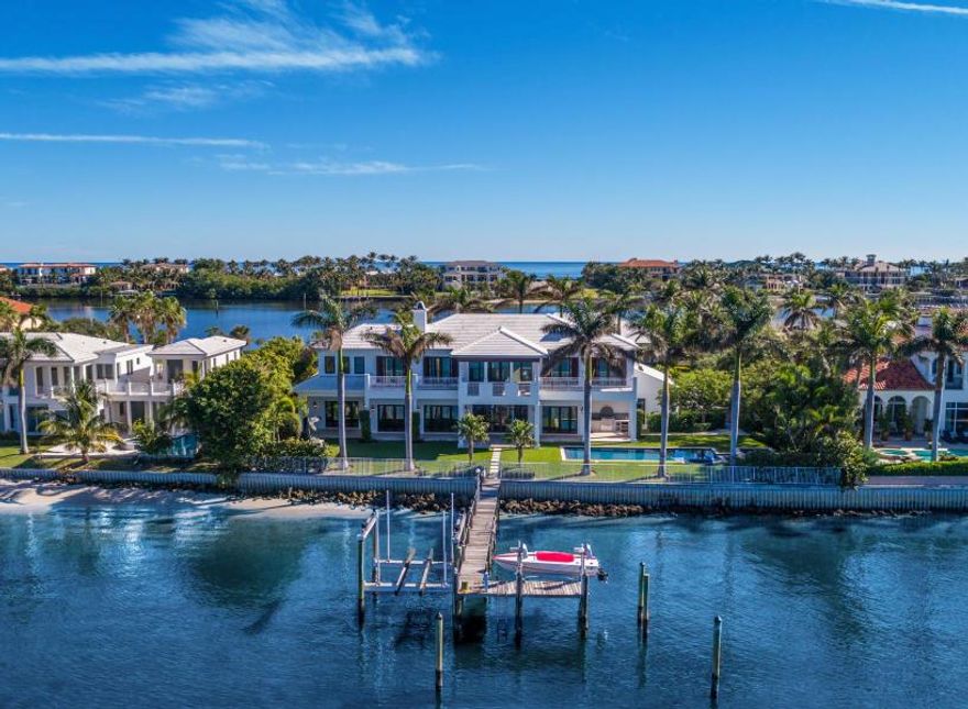 Casually elegant living is at home in the relaxing realm of this contemporary island-inspired estate looking out on the gorgeous wide Intracoastal waters. A stately 2-story reception room brings guests into the expansive waterside great room with chef's kitchen, leading to the entertainment verandah by the pool. Another romantic waterside verandah spans the grand but gracious master suite. The boat dock has 2 lifts. The information herein is deemed reliable and subject to errors, omissions or changes without notice.  The information has been derived from architectural plans or county records. Buyer should verify all measurements.