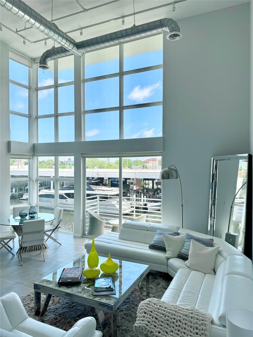 Experience relaxed living in the heart of desired Harbordale! Housed in a boutique building with just 8 units, this designer-furnished 2/2 modern loft offers an open floor plan with 18' floor-to-ceiling windows with plenty of light throughout. The stairs lead to the oversized primary bedroom loft featuring North and South views. See the water or enjoy sunrise & sky views from the balcony. Perfect for boat lovers, RARE PRIVATE DOCK -with water and electric- up to 36' boat! Quick ocean access with no fixed bridges & launch site down the road. Walk to top restaurants, shops, whole foods. Privileged location minutes to the beach, Airport, and Port. 2 Assigned parking spots. Small pets allowed. Fully furnished & equipped, move-in ready, don’t miss out on this, rarely available, waterfront gem!