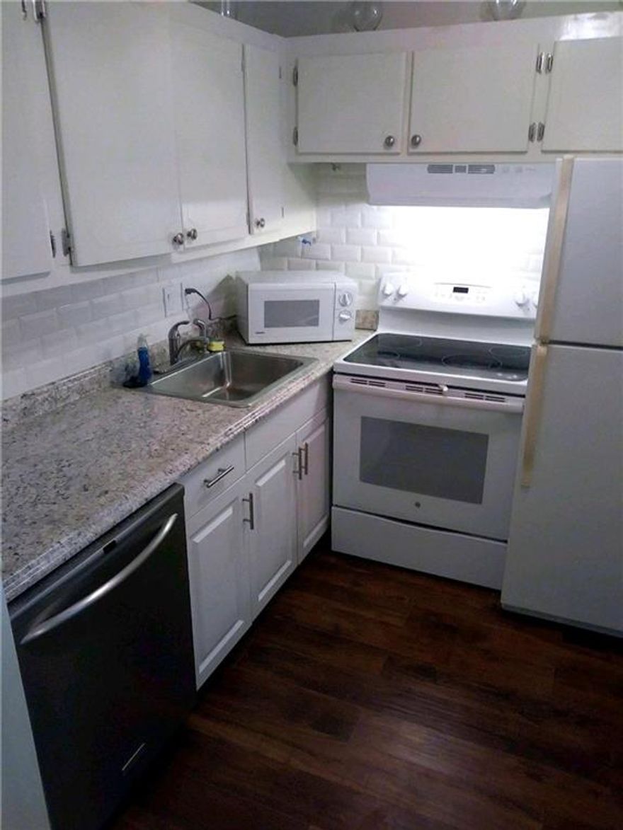 Don't miss out on this 1/1 in the desirable 55+ Durham location of Century Village East.  New wood floors recently put in.  Nice kitchen counter tops and the bathroom was just remodeled.  An easy walk to the clubhouse & pool.  The bus stop is right in front of the building.  This community includes a great clubhouse, free classes, shows, movies and gym.  Conveniently located close to highways and a short drive to the beach.  This condo is vacant and easy to show.  Possible owner financing with 20% down!