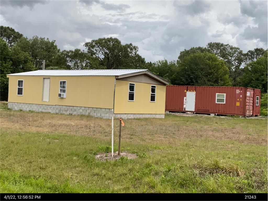 ATTENTION future home owners and investors!!! This one won't last long priced to move! Cute 3/2 partially remodeled on 1.9 acres awaiting your personal touch. Needs a special someone to complete the work or hire your own. Extra building supplies will convey. Conex boxes do NOT convey and can be negotiated.