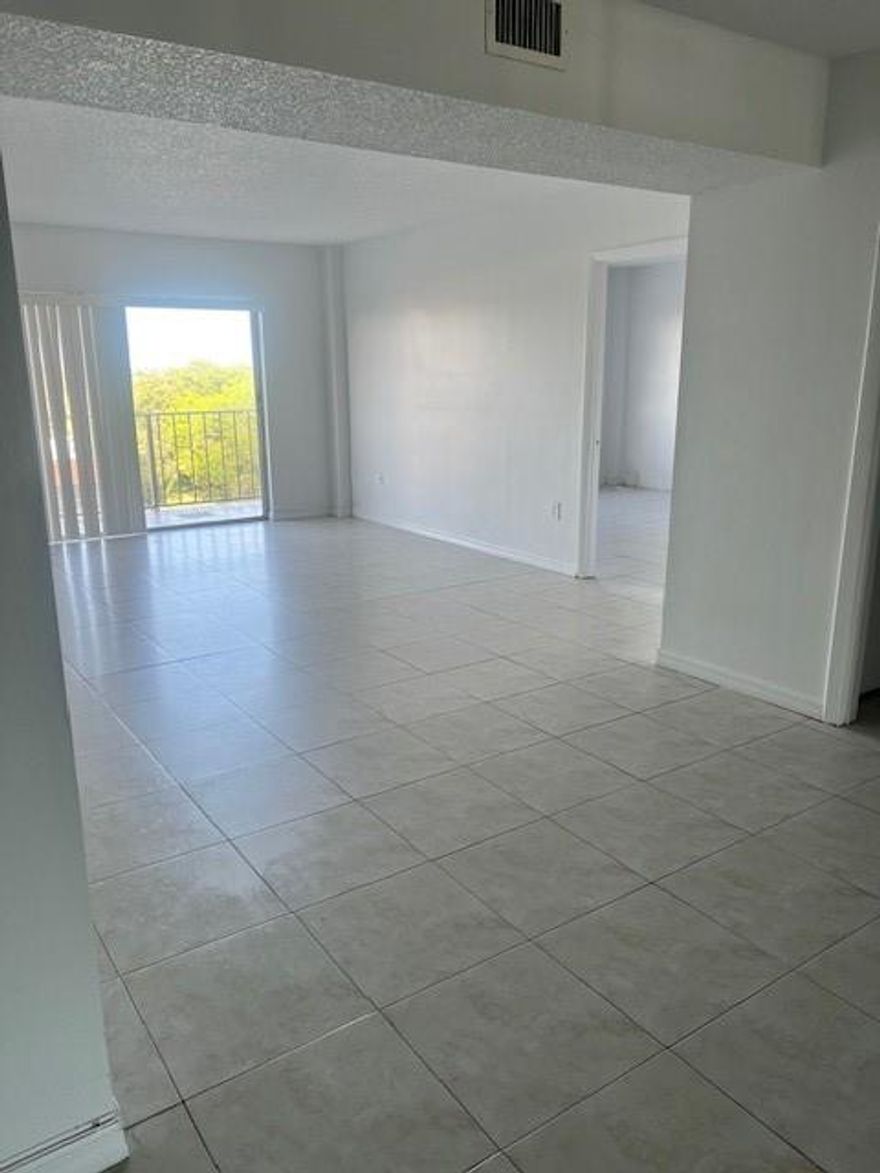 ALL AGES WELCOME - NO Reserves, Cash only - Bring your best offer!
Discover this spacious 2-bedroom, 2-bath residence offering a bright open-concept design and tile flooring throughout. The desirable split-bedroom layout provides added privacy, while in-unit laundry, central A/C, and assigned parking add everyday convenience.
The building features a brand-new roof and has successfully completed its 40-year certification, offering long-term peace of mind. This move-in-ready home is ideal for first-time buyers, downsizers, or investors seeking an excellent opportunity in a vibrant community. 

Association requirements: minimum 650 credit score and income of $40,000 for a single owner or $60,000 combined household income. 
*Stove will be replaced by owner, washer/dryer in unit*