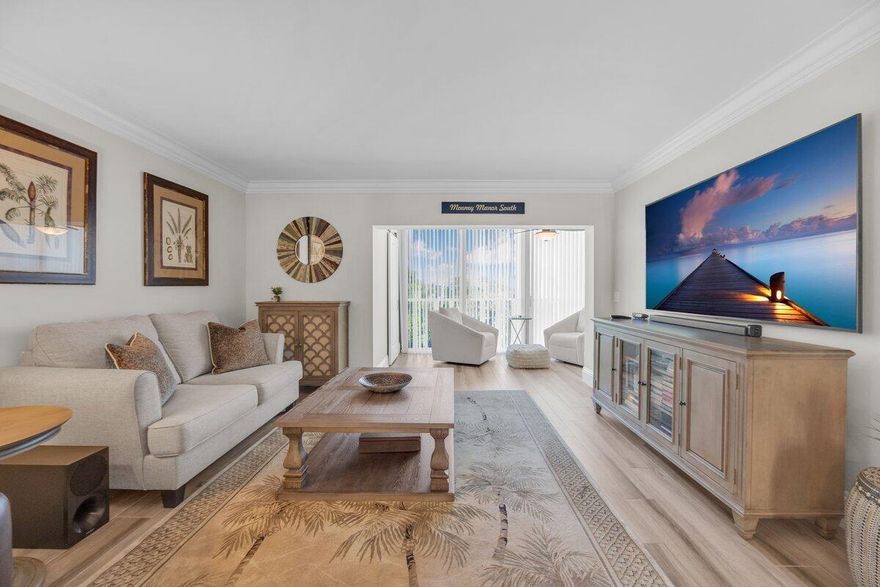 Penthouse-level, top-floor 2BR/2BA end unit just a short walk from the sand, offering exceptional privacy, natural light, and a beautifully updated interior. Thoughtfully renovated with high-end finishes and a clean coastal design, this move-in-ready residence delivers comfort, style, and effortless beach living.A soft coastal palette is complemented by a striking stone accent wall, adding texture and visual interest. The home features porcelain flooring throughout, crown molding, updated doors and hardware, custom window treatments, California Closets, steam-cleaned air ducts, and full impact glass for security and peace of mind.The kitchen blends function and style with granite countertops, Bosch appliances, and a built-in wine refrigerator—ideal for everyday living and entertaining.An  enclosed lanai extends the living space, framed by 16 feet of impact glass sliders overlooking serene garden views. Open them to invite in the ocean breeze and create a seamless indoor-outdoor feel.  Major systems have been updated, offering true move-in-ready convenience. A subtle sightline to the Jupiter Lighthouse adds a touch of local character.  Located within a quiet, beautifully maintained 30-acre community, enjoy a peaceful, park-like setting just minutes from Jupiter's beaches, intracoastal waterways, and popular waterfront dining and destinations.