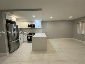 Photo of 500 Village Green Circle W #215, Palm Springs, FL 33461 (MLS # B26076185)