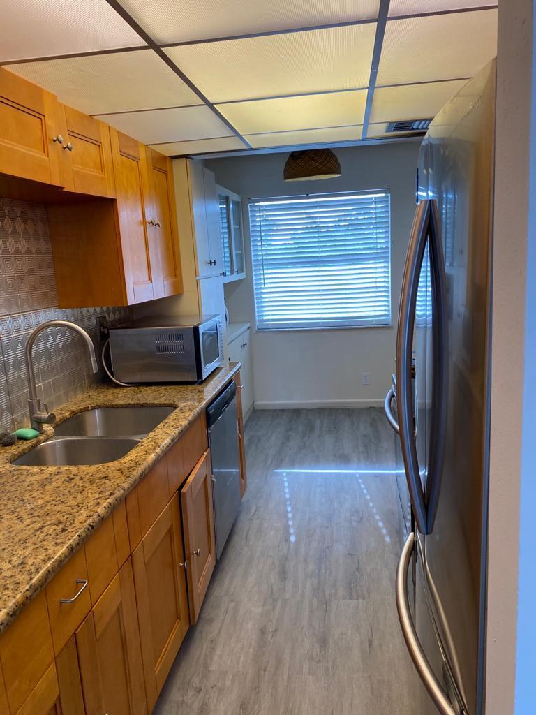 Photo of 3161 NW 47TH Terrace #402, Lauderdale Lakes, FL 33319 (MLS # B26074101)