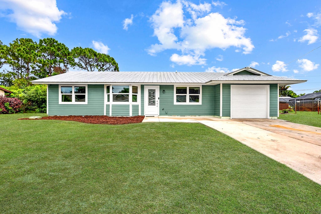 Photo of 2291 SW Franklin Street, Port Saint Lucie, FL 34953 (MLS # B26036101)
