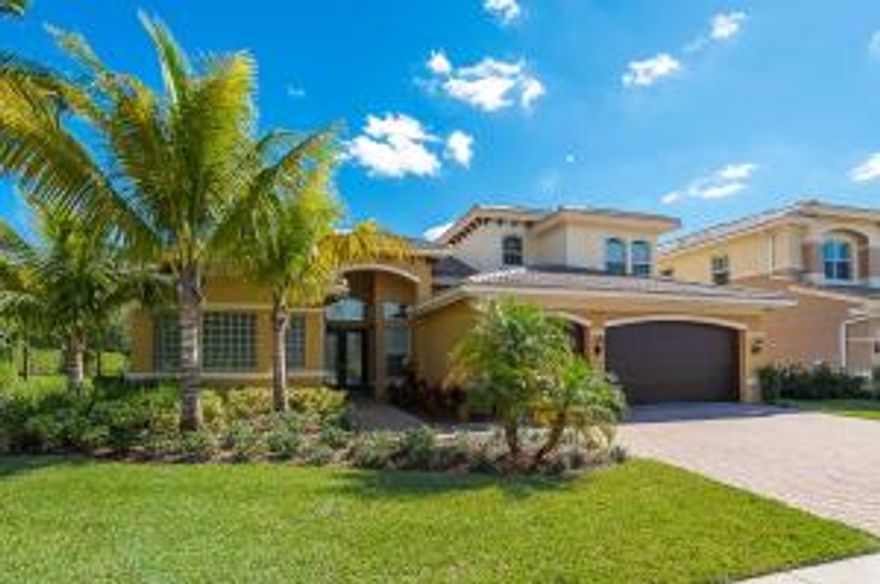 Spectacular home with 5 bedrooms, 4 baths, 3-car garage with 3,677 AC SQ FT and a beautiful lake view. Chef's kitchen with all stainless appliances, double ovens, 42'' cabinets with crown molding, under cabinet lighting, granite counter top, tile backsplash, snack bar and family dining area. Huge master suite with a coffer ceiling, bay window, sitting area and his and hers walk in closets. Elegant master bath with dual sinks, garden tub and a walk in shower. Spectacular 2 storied family room with lots of natural light. Large loft can be used as a 2nd family room. Canyon Springs is located close to shopping, A rated schools, restaurants, trendy Atlantic Ave and the Florida