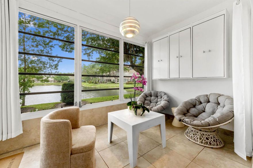 Prepare to be captivated by this truly stunning and unit in the highly sought-after Hawaiian Gardens. This isn't just a home; it's a front-row seat to paradise, offering amazing water views from every vantage point! Located directly on the first floor, you'll enjoy effortless access to the beautifully maintained backyard, making outdoor living a breeze. Inside, the home shines with a meticulously remodeled kitchen featuring elegant white cabinets that extend all the way to the ceiling, complemented by a beautiful backsplash. Experience enhanced security and peace of mind with new hurricane-resistant windows throughout, and included is a versatile Florida Room.