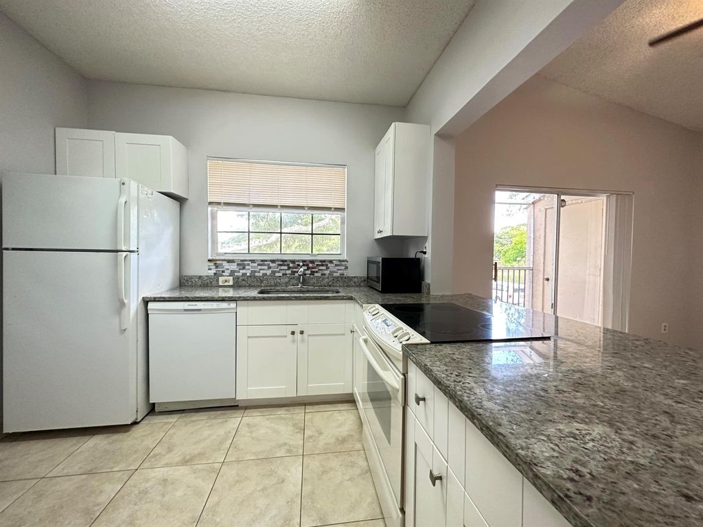 Photo of 840 Cypress Park Way #D, Deerfield Beach, FL 33064 (MLS # R11073637)