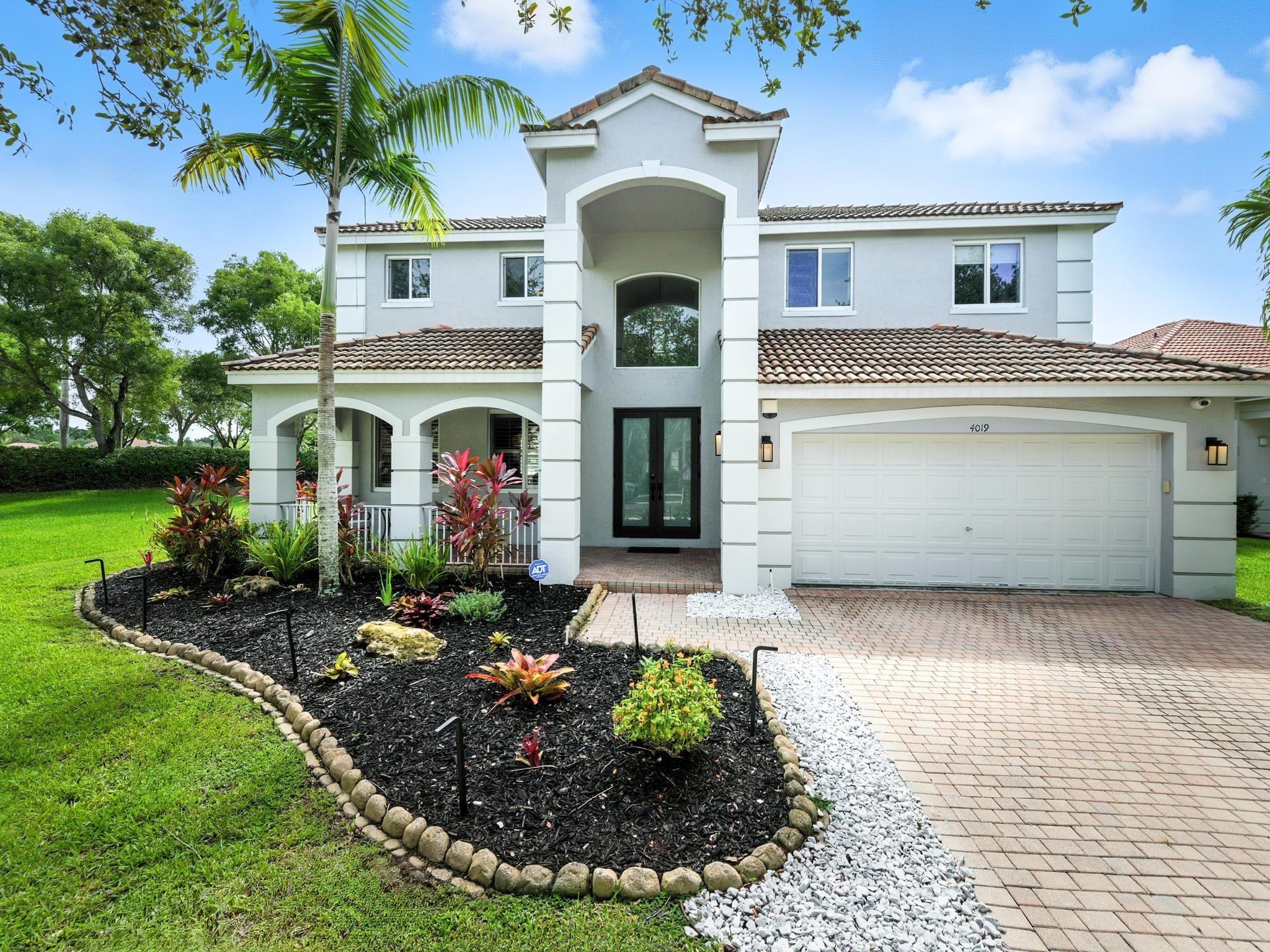 This resort-style modern home features hurricane-impact windows/doors (2023), an open kitchen with center island, and a private outdoor paradise. The saltwater pool was redesigned with waterfall features, new heater (2021), resurfaced in 2024 with a bonus sun ledge. A high-end cabana includes a full outdoor kitchen with pergola, granite countertops, bar seating, refrigerators, gas BBQ & griddle. Bathrooms were fully renovated in 2022. Engineered wood flooring throughout, custom millwork with crown molding, plantation shutters, custom built-ins (2022), and Closets by Design systems (2020). Ample storage, quiet cul-de-sac, and a spacious double lot with open space. Gated Community with pool, park, pickleball ball, & close to A schools, restaurants, retail, and library