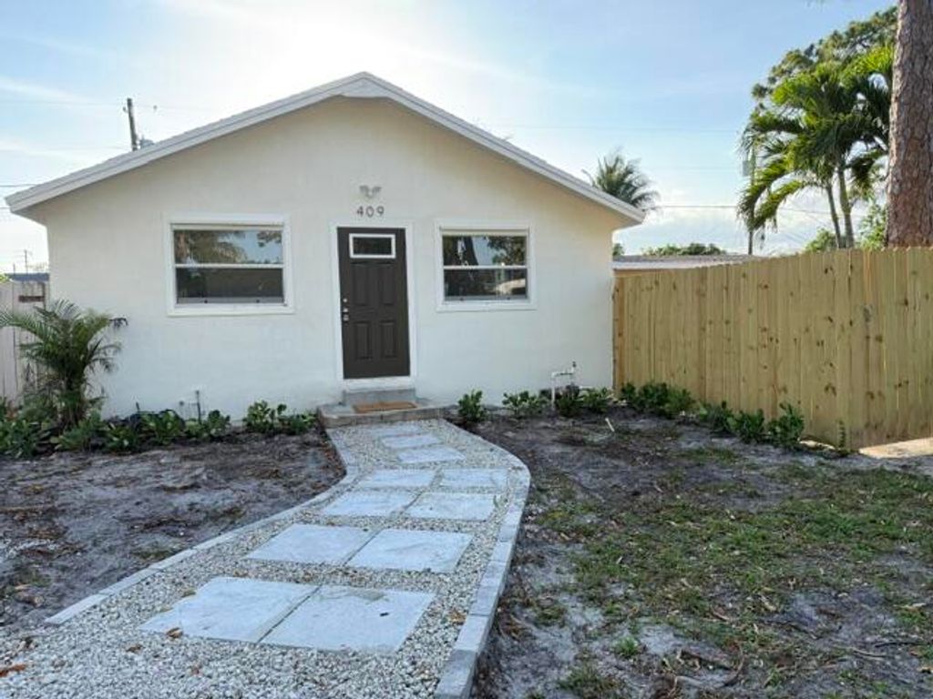 Photo of 409 Perry Avenue, Greenacres, FL 33463 (MLS # B26024781)