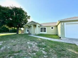 Photo of 501 SE Sweet Avenue, Port Saint Lucie, FL 34983 (MLS # R11082606)