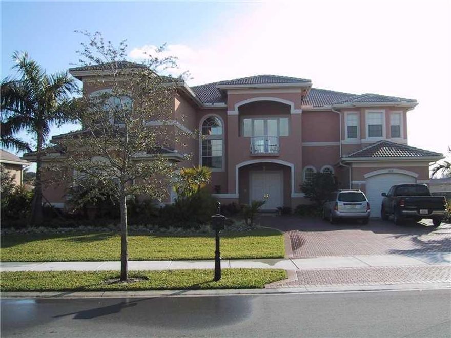Beautiful home with the best water views in long lake ranches. This Van Gogh model was customized with marble floors, crown molding, and decorative medallions on the ceilings. Formal living room has wet bar. Spacious master bedroom has 2 walk-in closets plus attached exercise room. Master bath with dual vanities and Jacuzzi tub, walk in shower and private water closet. Ample laundry room with laundry tub. Chandeliers do not convey.