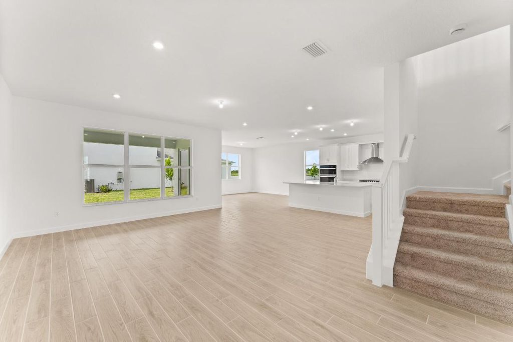 Photo of 9546 SW Indra Way, Port Saint Lucie, FL 34987 (MLS # R11056252)