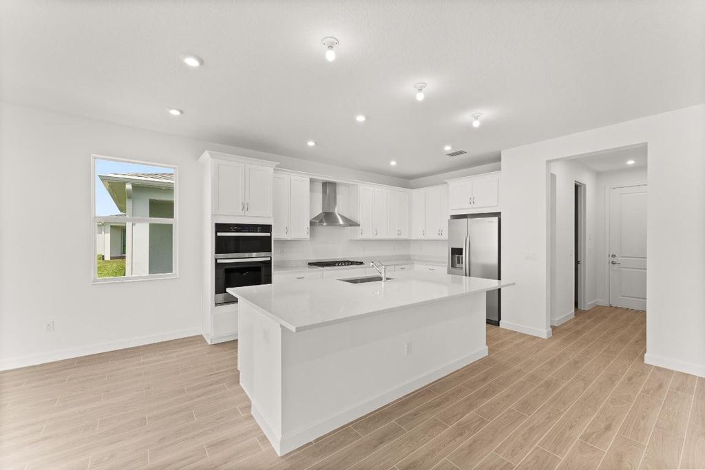 Photo of 9546 SW Indra Way, Port Saint Lucie, FL 34987 (MLS # R11056252)