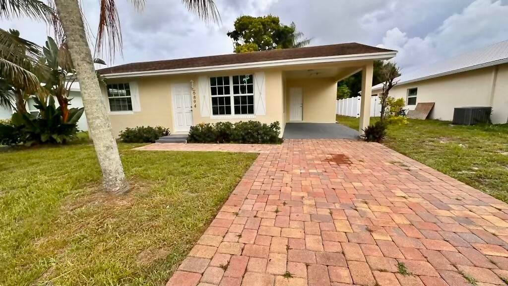 Photo of 6894 3rd Street, Jupiter, FL 33458 (MLS # R10999776)