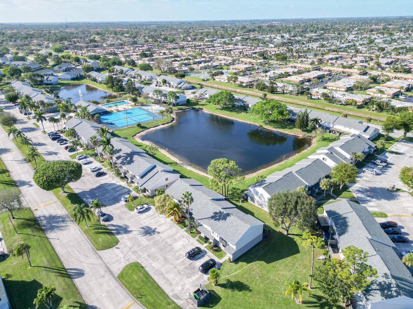 This beautiful townhouse, situated in the heart of Greenacres, Florida, offers a perfect blend of comfort and convenience. Featuring two spacious primary suites upstairs, each accompanied by its own bathroom, this residence is ideal for those seeking privacy and ease. With a total of 2 bedrooms and 2.5 baths, Located in a central area, residents have easy access to an array of amenities. From dining at nearby restaurants, exploring local shopping centers, to convenient travel with major airports just a short drive away, everything you need is within reach. Adding to its appeal are the serene lake view, providing a picturesque backdrop to this delightful home. Renovated Kitchen and baths gives a touch of elegance to the home.