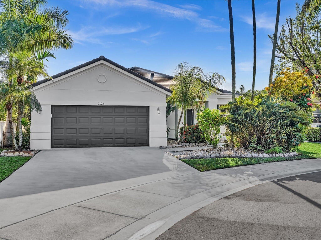 Photo of 1125 Sunflower Circle, Weston, FL 33327 (MLS # B26085347)