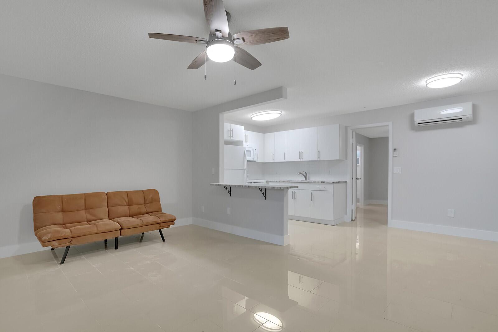Nestled in the vibrant heart of trendy Lake Worth Beach, this meticulously updated one-bedroom, one-bath apartment offers a seamless blend of modern elegance and coastal living. Boasting exquisite tile flooring and granite countertops, this inviting abode exudes sophistication and style. Ideally situated close to the beach and 95, residents can indulge in the ultimate beach lifestyle and easy access to all S. Florida has to offer. Embrace the convenience of having the option to install a washer and dryer within the unit or opt for a fully furnished turnkey experience. With its prime location, this gem promises an unparalleled opportunity to immerse oneself in the area's dynamic social scene, world-class dining, and endless recreational pursuits. Move in First Month rent and security.