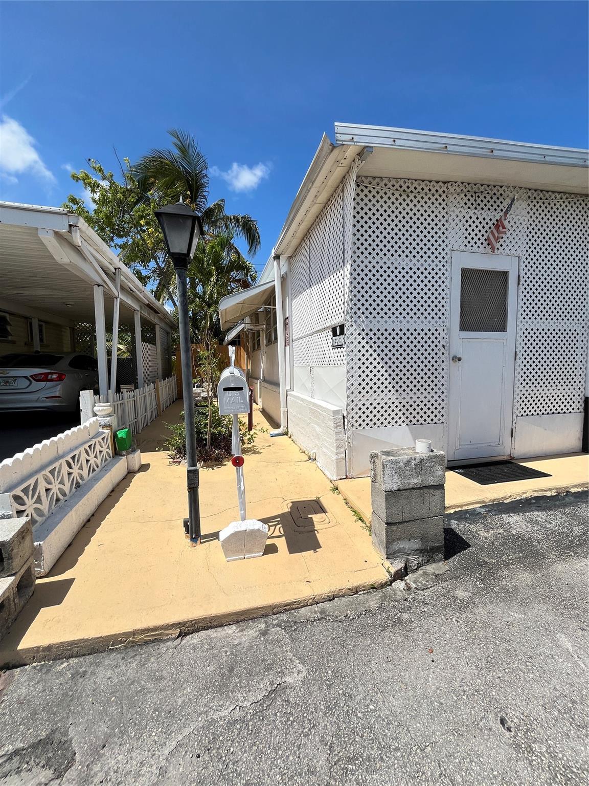 Hallandale Trailer Estates offers family living at an affordable price. This 2/2 mobile home sits on land-owned property. No lease fees, since the land is owned! This is an all-ages community and allows for immediate rentals. The mobile home needs to be updated inside. It offers a lovely outdoor back area space with a shed for extra space. ALL CASH only offers will be considered.
