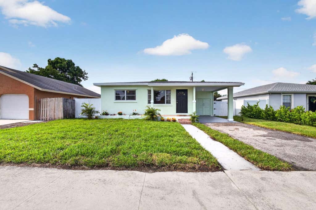 Photo of 1547 W 10TH Street, Riviera Beach, FL 33404 (MLS # B26059810)