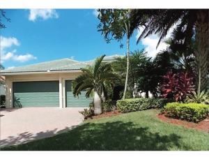 Beautiful lake views. Gourmet island kitchen with double bar seating and breakfast nook open to large family room. Upgrades include accordion shutters, tile on diagonal, engineered flooring, crown, screened patio and heated pool, lush tropical landscaping! Gated golf course community with private clubhouse, community pool, fitness room, basketball and tennis courts. Close to A rated schools, I95 & Turnpike
