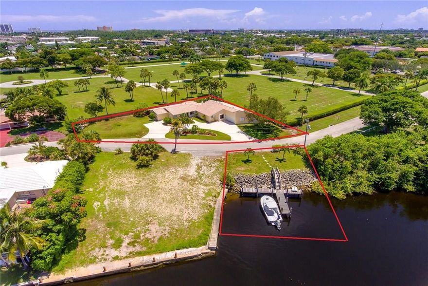 STOP BY AND CHECK OUT THIS UNIQUE DOUBLE LOT HOME, ON ALMOST HALF AN ACRE, WITH A T-DOCK ON THE HILLSBORO CANAL!!! LARGE 3 BED, 4 BATH W/ POOL, OFFICE, LAUNDRY ROOM & SITTING AREA. IN LAW SUITE AND OFFICE HAS SEPARATE ENTRIES THAT COULD BE PRIVATE FROM REST OF HOME. HIS AND HERS WALK-IN CLOSETS (HERS IS HUGE!) HOME HAS A HUGE 2 AND HALF CAR GARAGE W/ CIRCULAR DRIVE. NEW S.S. APPLIANCES. ELECTRIC PANEL IS 1 YR OLD & BARREL TILE ROOF IN 2006. WON'T LAST!