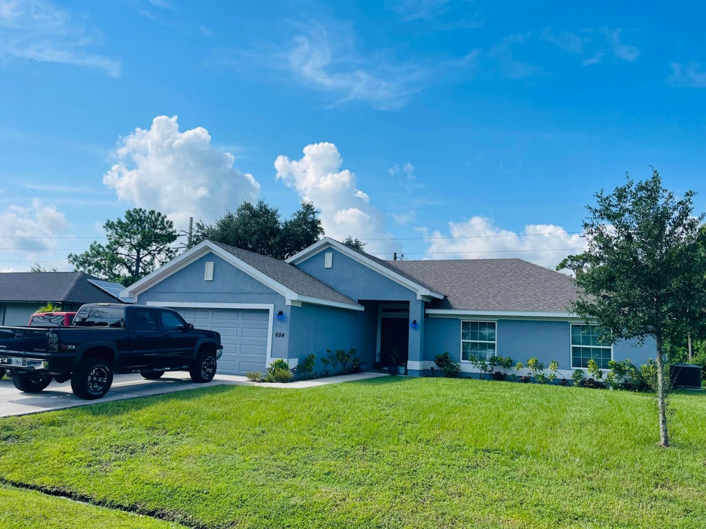 Photo of 684 SE Chapman Avenue, Port Saint Lucie, FL 34984 (MLS # R11011126)