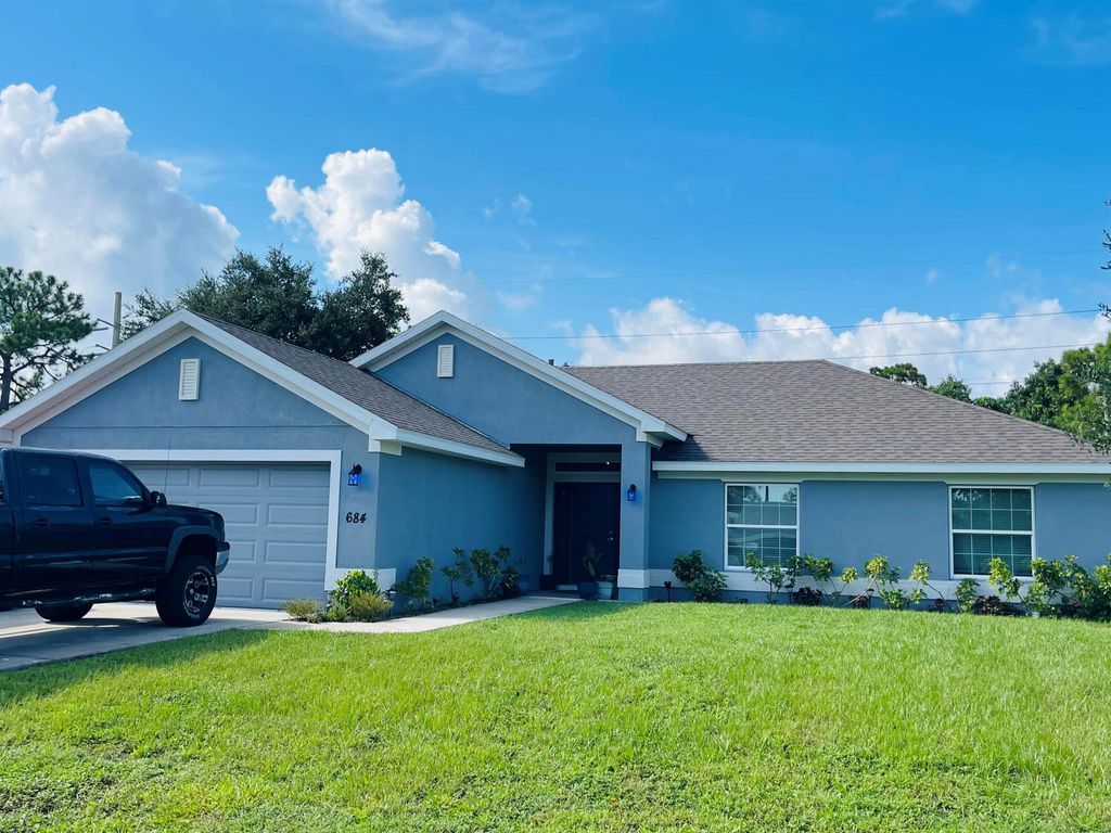 Photo of 684 SE Chapman Avenue, Port Saint Lucie, FL 34984 (MLS # R11011126)