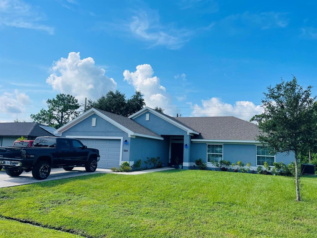 Photo of 684 SE Chapman Avenue, Port Saint Lucie, FL 34984 (MLS # R11011126)