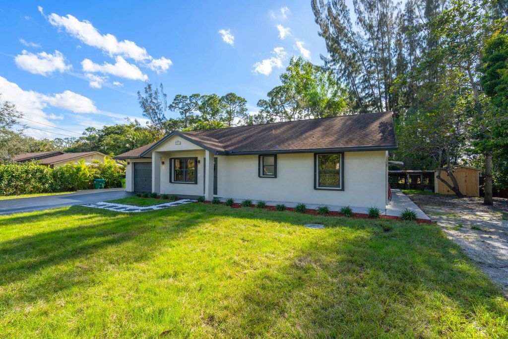 Photo of 15438 Los Angeles Drive, Loxahatchee Groves, FL 33470 (MLS # R11148077)