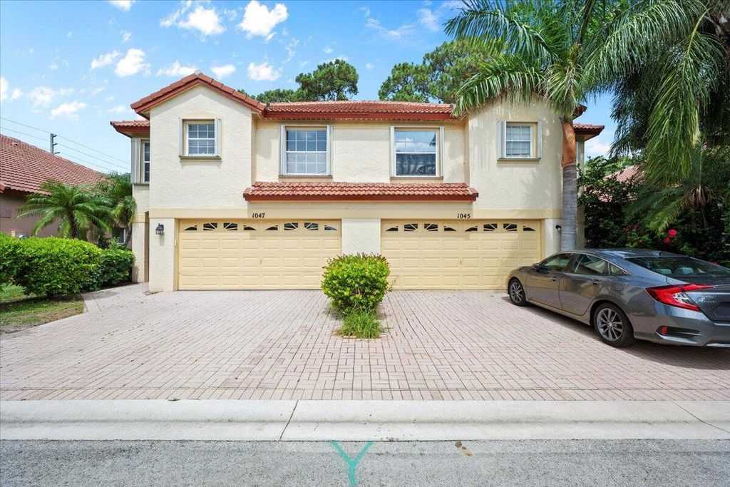 Photo of 1047 Via Jardin, Riviera Beach, FL 33418 (MLS # R11099214)