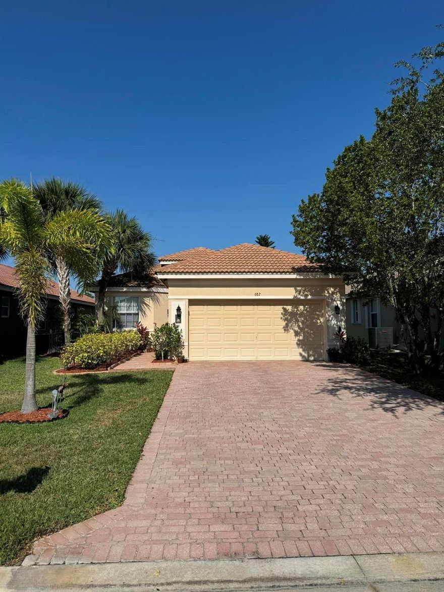 FOR SALE:  DON'T MISS THIS BEAUTIFUL 3/2/2 GOLF COURSE HOME!   THIS HOME FEATURES BARREL TILE ROOF, HIGH VAULTED CEILINGS, SCREENED PATIO OVERLOOKING THE GOLF COURSE, RETRACTABLE SCREEN DOOR ON THE FRONT ENTRANCE, SPACIOUS MASTER SUITE WITH GARDEN TUB AND SEPARATE SHOWER,  SPACIOUS LIVING AND DINING AREA, PLANTATION SHUTTERS, WOOD LAMINATE FLOORING IN THE BEDROOMS, TINTED PATIO SLIDERS, MICRO SCREEN ON THE PATIO TO KEEP OUT INSECTS, BEAUTIFULLY LANDSCAPED AND METICULOUSLY MAINTAINED INSIDE!  THIS HOME IS SECURELY NESTLED IN A GATED COMMUNITY WITH A BEAUTIFUL GOLF COURSE, TENNIS COURTS, CLUBHOUSE, GYM, POOL AND HOT TUB, PLAYGROUND, DRIVING RANGE, BASKETBALL COURT, WITH A LOW HOA OF $ $230 PER MONTH!  682 NW STANFORD LANE PSL 34983.  Schedule your showing today.