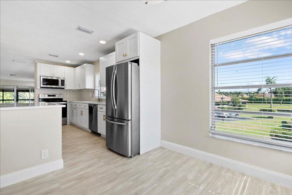 Photo of 13921 Royal Palm Court #D, Delray Beach, FL 33484 (MLS # B26024690)