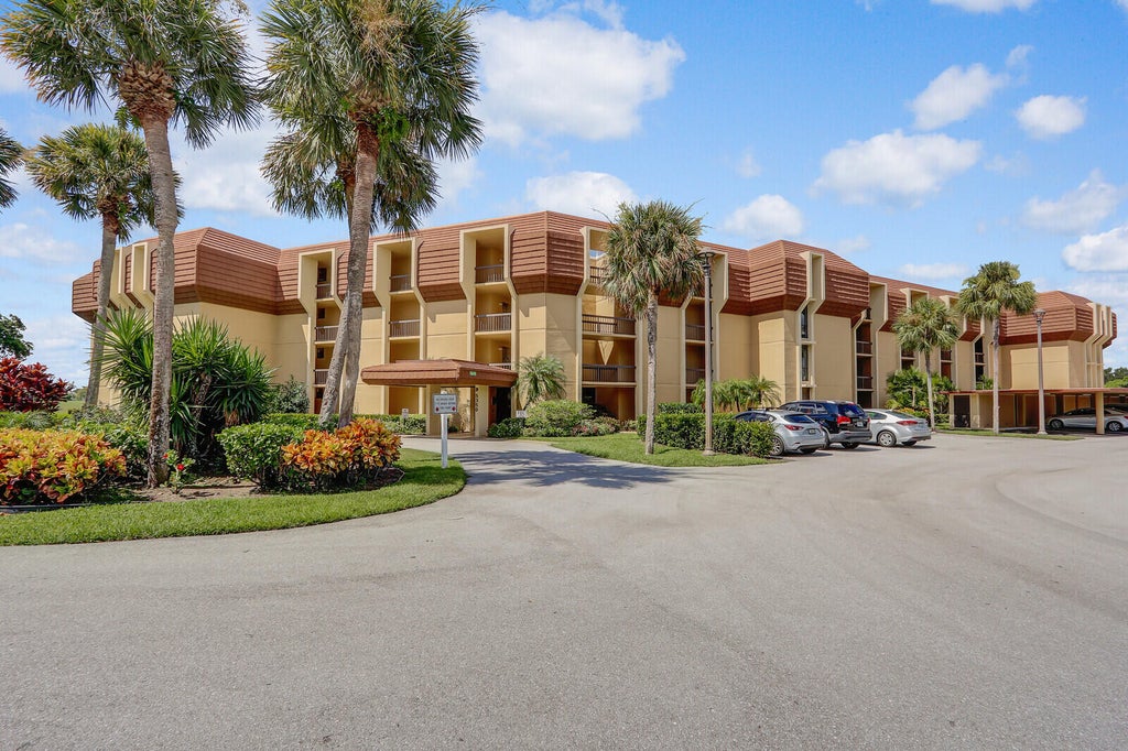 Photo of 5350 Woodland Lakes Drive #111, Palm Beach Gardens, FL 33418 (MLS # R11118879)