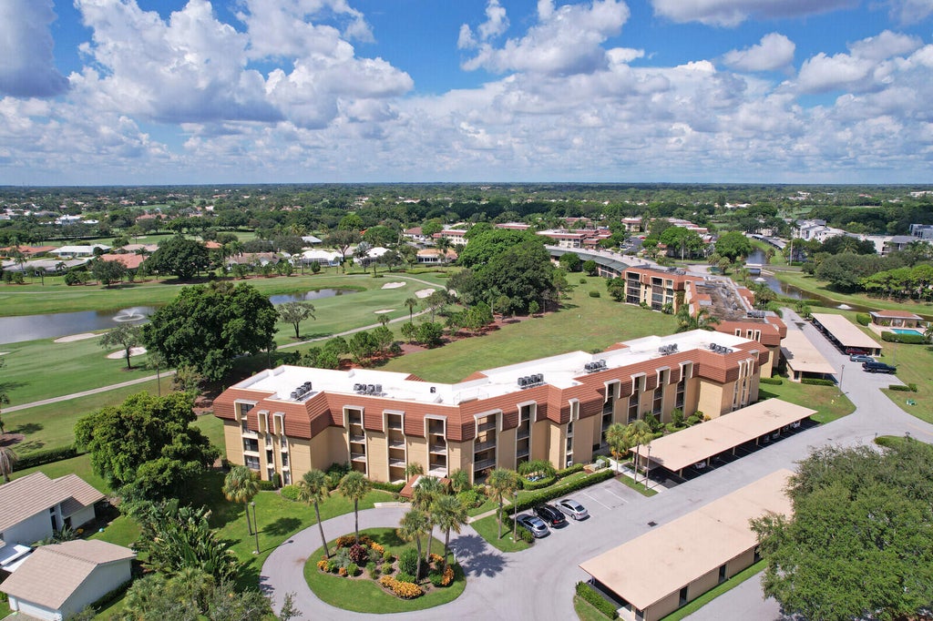 Photo of 5350 Woodland Lakes Drive #111, Palm Beach Gardens, FL 33418 (MLS # R11118879)