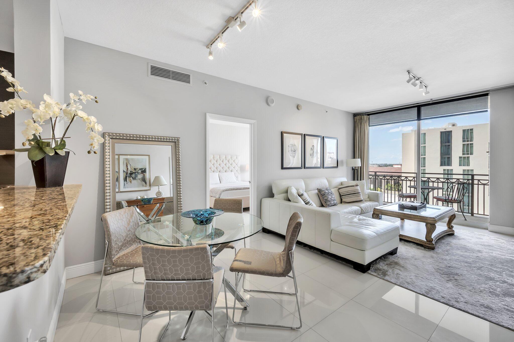 Available Annually, or for FULL 6-month Seasonal!! Welcome to your Light, Bright & Airy sanctuary! Experience the epitome of modern living in this turnkey, fully furnished retreat. Perfectly situated in the heart of booming and picturesque Downtown West Palm Beach, mere steps away from all the vibrant action! Indulge in unparalleled relaxation as you unwind on your private balcony oasis, offering breathtaking sunsets, a serene sea of palm trees, and mesmerizing city views that come alive with a twinkle after dusk. Step inside and be captivated by the contemporary open layout, adorned with ceramic tile throughout the living areas and cushy carpet in the bedrooms. The kitchen boasts elegant granite countertops, stainless steel appliances, and an abundance of storage space.