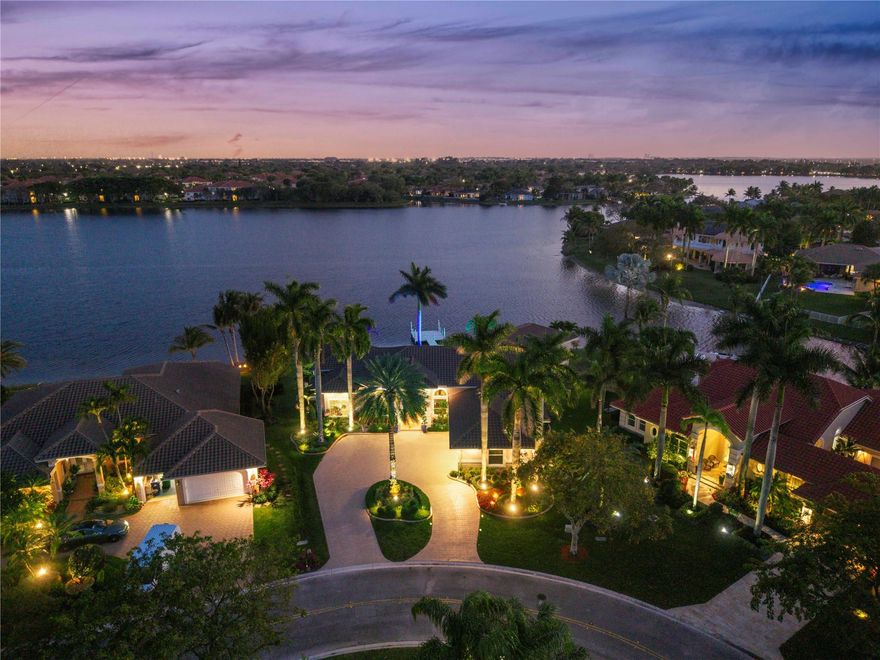 Spacious 4-bedroom home with office and 4.5 baths in the Isles east in Coral Springs, designed for comfortable living and entertaining. Features include a new roof (2023), circular driveway, and all impact glass for added peace of mind. Private Boat dock. The gourmet kitchen is equipped with a 6-burner gas stove and wine cooler. Step outside to a resort-style backyard with a heated pool and spa, summer kitchen, and private boat dock. Enjoy unbelievable lake views that create a stunning backdrop for everyday living. This exceptional property offers the perfect blend of luxury, functionality, and waterfront lifestyle.