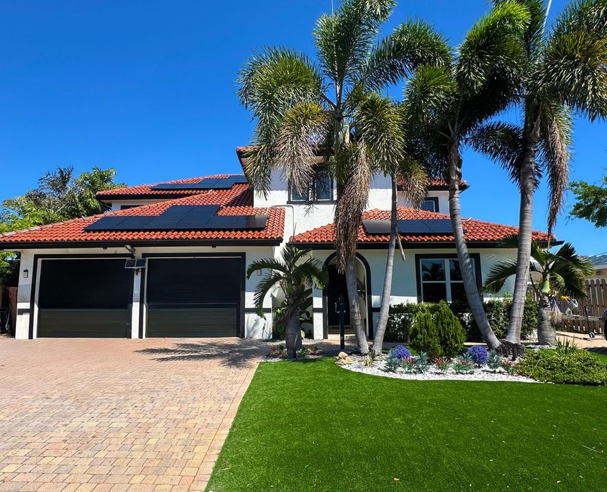 Largest available waterfront home under $2M in Fort Lauderdale! 3,500+ sf living area, 6 bed, 75ft ocean access canal, private dock w/ 10klb boat lift, heated saltwater pool, summer kitchen with gas. Beautiful updated kitchen, double oven, extra outdoor living space. 3 bedrooms on first floor, large primary suite w/ covered patio.  Built in 2013, impact windows and doors, dual zone AC, PVC plumbing, 2 Rinnai tankless water heaters, motorized hurricane screens, smart home and security system. 3 EV chargers and well water irrigation. Located on a quiet dead end street with no through traffic. Oversized driveway, 2 car garage + add'l parking for 8+ vehicles. Located in Coral Ridge Isles, no HOA, close to beach, dining, and shopping. Rare value for a large waterfront home with ocean access.  Solar system installed for improved energy efficiency. Details available upon request.