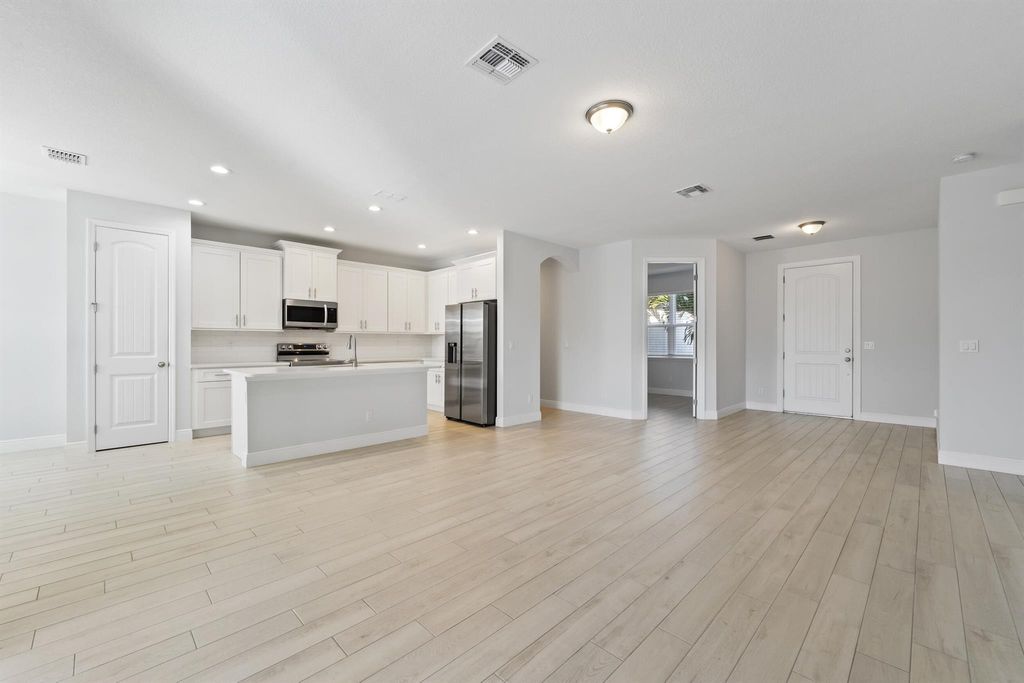 Photo of 476 SW Crawfish Drive, Port Saint Lucie, FL 34953 (MLS # R11145645)