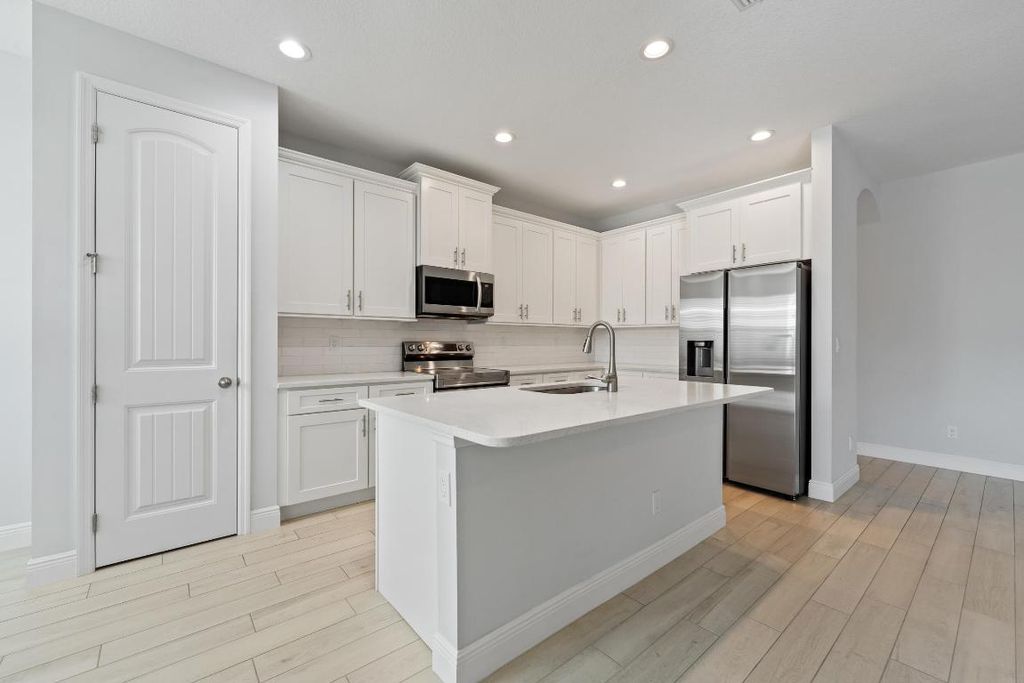 Photo of 476 SW Crawfish Drive, Port Saint Lucie, FL 34953 (MLS # R11145645)