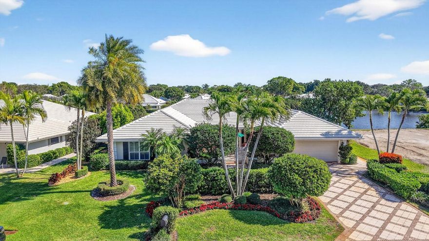 Pristine, traditional home offering 3 bedrooms/den with over 3400 a/c sq ft.  Lovely, gated courtyard entrance leading to entry w/custom double doors.  Open flow into the living area with high ceilings and custom wet bar.  Spacious primary suite with sitting area, his and her closets and updated bathroom.  Formal dining room, updated kitchen and family area.  The laundry room has LG w/d, custom cabinets and much more.  Garage is a/c with epoxy flooring.  Screened pool area and covered patio.  Lovely home, great for entertaining!! Improvements: 2025 new well for irrigation, new refrigerator, 2022, new roof, 500-gal gas tank, W/D, Water heater, generator, 2 A/C, pool pump, A/C in garage & epoxy flooring.  This home is one of a kind and you don't want to miss it! Mandatory golf members This home is special and one of a kind. Come enjoy quiet luxury living in this beautiful traditional home with lake views.  Delray Dunes Golf and Country Club offers golf, tennis, fine dining, fitness center and much more. Membership fee is $115,000. Location is close to shopping, dining, I95, turnpike, WPB airport, and hospitals.