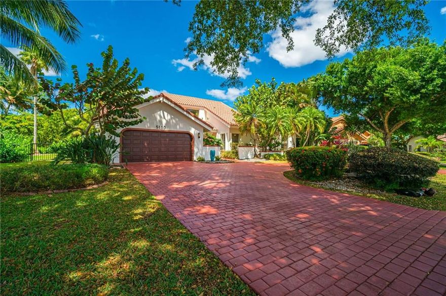 Don't miss this immaculate home in the heart of Pine Ridge; a verdant community that will allow you to Relax, Enjoy & Love where you Live! This crisp 4 bed 2 1/2 bath home, with its striking vaulted ceilings will undoubtedly impress you! Large & unique floorplan, split bedrooms, enormous master suite, master bath & walk-in closets! Open kitchen with white cabinets, elegant backsplash, stainless appliances & a large counter bar area. It is simply the perfect place to entertain! Snug family room with working fireplace. The stackable patio slide doors invite you to the screened pool area, where you can enjoy the long water views & soak in nature. Freshly painted outside & full impact coverage. Fenced in yard on a desirable over 12,000 sqft lot. It simply has it all, come see! Open the 1st