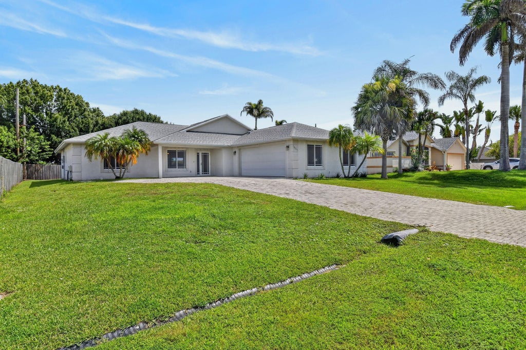Photo of 1061 SW BENSCHOP Avenue, Port Saint Lucie, FL 34953 (MLS # B26057585)