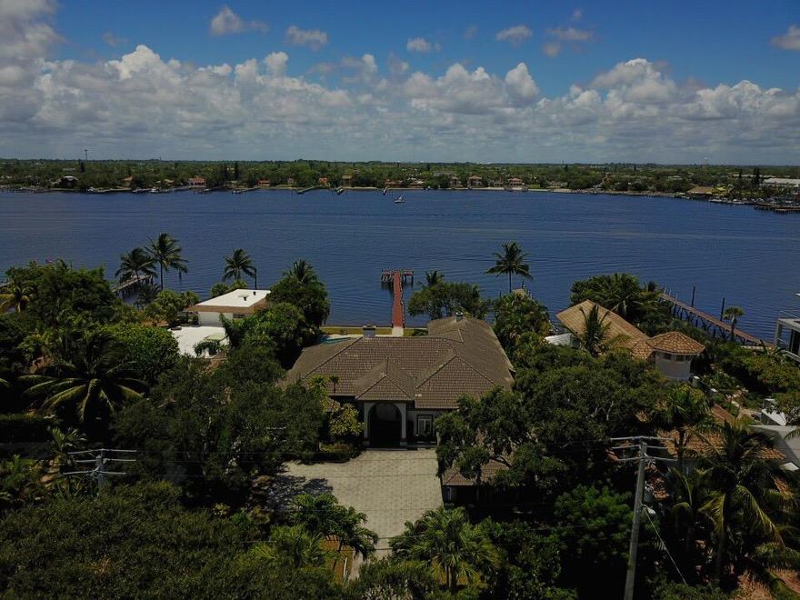 Beautiful 4 bedroom 4 bathroom Private Home with direct Intracoastal Views !!! Longest dock on the point deep water access. This home is famous for its sunsets and perfect entertainment patio deck bar and pool. Enter the home to see great views of the water and spacious living space. Master great size and views of the water his and her baths and closets jacuzzi tub and shower. Entertainment bar style lounge seating island white kitchen with granite counters. Connected cabana bath with small kitchen pool storage and nice shower bath. Long dock setting ads a perfect feeling to Florida living.