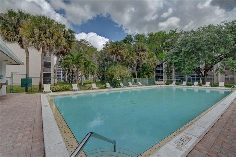 Photo of 8735 Ramblewood Drive #212, Coral Springs, FL 33071 (MLS # B26089559)